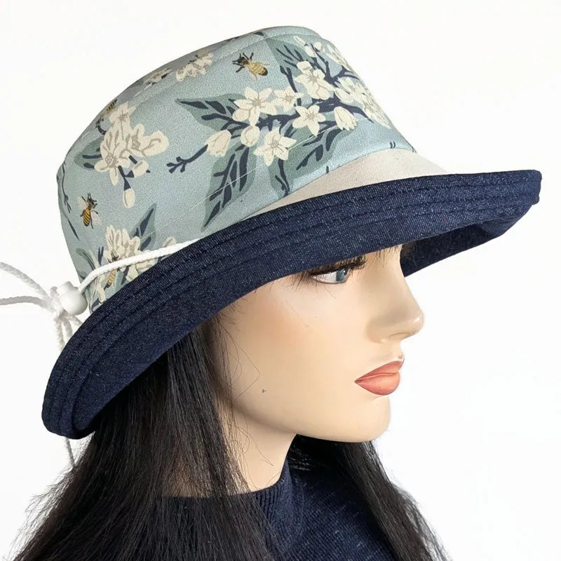Sunblocker UV sun hat with large wide bucket brim, featuring bees in blues, adjustable fit